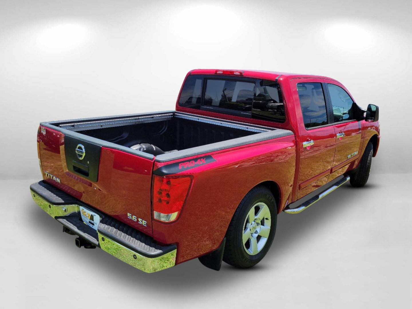 2006 Red Nissan Titan (1N6BA07BX6N) with an Gas/Ethanol V8 5.6L/339 engine, 5-Speed Automatic w/OD transmission, located at 7000 Northlake Connector, Columbus, GA, 31904, (706) 987-8085, 32.524975, -84.978134 - 2006 Nissan Titan - Photo#4