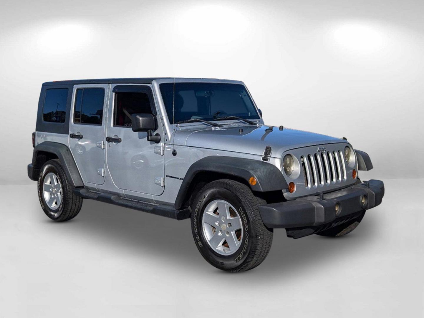 2010 /Dark Slate Gray/Medium Slate Gray Jeep Wrangler Unlimited Sport (1J4BB3H13AL) with an Gas V6 3.8L/231 engine, 4-Speed Automatic transmission, located at 1430 Gateway Drive, Opelika, AL, 36801, (334) 239-0944, 32.637871, -85.409790 - 2010 Jeep Wrangler Unlimited Sport - Photo#2