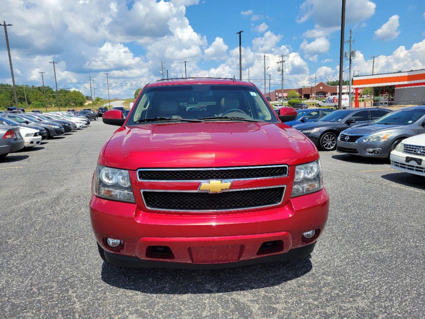 2012 Crystal Red Tintcoat /Light Cashmere/Dark Cashmere Chevrolet Tahoe LT (1GNSKBE05CR) with an Gas/Ethanol V8 5.3L/323 engine, 6-Speed Automatic w/OD transmission, located at 5115 14th Ave., Columbus, GA, 31904, (706) 323-0345, 32.511494, -84.971046 - 2012 Chevrolet Tahoe LT - Photo#2