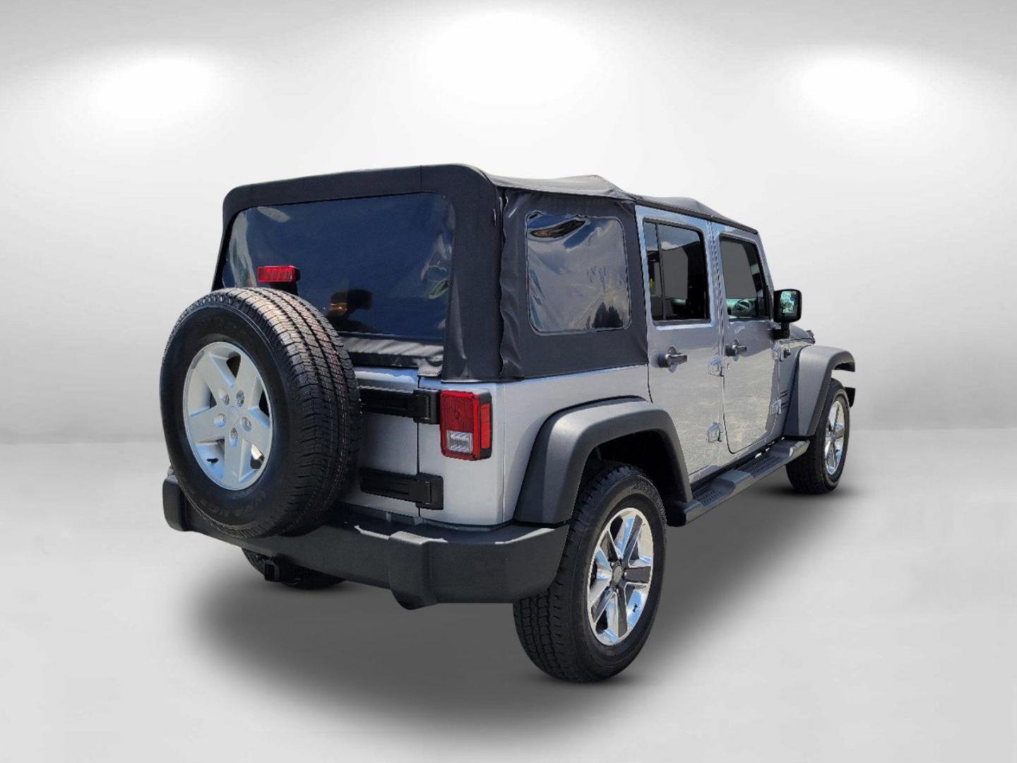 2015 Billet Silver Metallic Clearcoat /Black Jeep Wrangler Unlimited Sport (1C4HJWDG2FL) with an Regular Unleaded V-6 3.6 L/220 engine, 5-Speed Automatic w/OD transmission, located at 7000 Northlake Connector, Columbus, GA, 31904, (706) 987-8085, 32.524975, -84.978134 - 2015 Jeep Wrangler Unlimited Sport - Photo#4