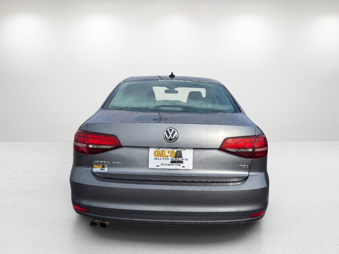 2016 Volkswagen Jetta Sedan (3VWL07AJ9GM) with an Intercooled Turbo Regular Unleaded I-4 1.8 L/110 engine, 6-Speed Automatic w/OD transmission, located at 5115 14th Ave., Columbus, GA, 31904, (706) 323-0345, 32.511494, -84.971046 - 2016 Volkswagen Jetta Sedan - Photo#5