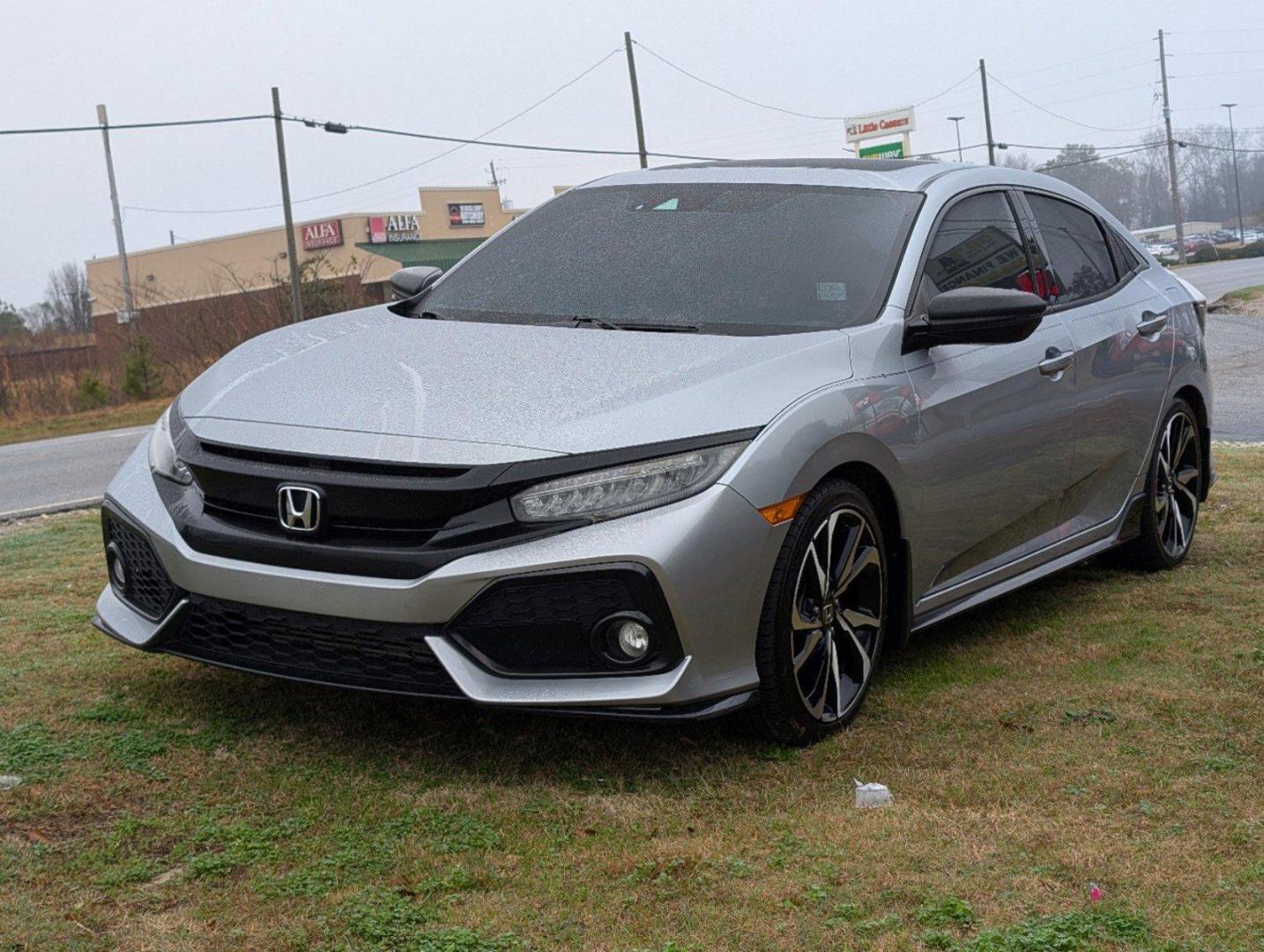 2019 Honda Civic Hatchback Sport Touring (SHHFK7H94KU) with an Intercooled Turbo Premium Unleaded I-4 1.5 L/91 engine, 1-Speed CVT w/OD transmission, located at 7000 Northlake Connector, Columbus, GA, 31904, (706) 987-8085, 32.524975, -84.978134 - 2019 Honda Civic Hatchback Sport Touring - Photo#0